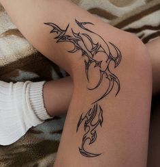 a woman with a tattoo on her leg