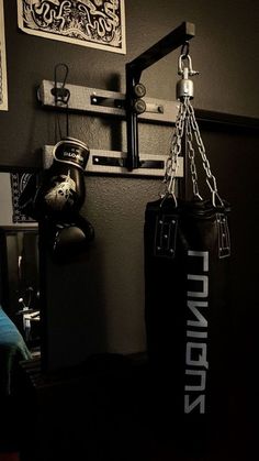 there is a boxing bag hanging on the wall