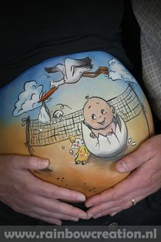 a pregnant woman's belly with an image of a baby on it