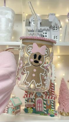 a glass cup with a straw in the shape of a teddy bear