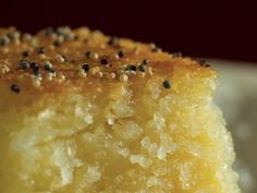 a close up of a piece of cake on a plate with sprinkles