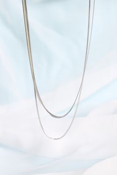 Okay we are obsessed! We LOVE the layered necklace look, and with this 2 in 1 necklace, you can achieve that style with ease. The herringbone style necklace chain is so classy and timeless, so you know you'll be wearing this for years and years. And since it's made to be such high quality (with solid stainless steel!) you know it will last you for years and years to come! Not only that- but because it is made with solid stainless steel, this necklace is also completely tarnish proof and complete Silver Chain Necklaces For Layering, Silver Double Strand Layered Necklace For Everyday, Dainty Snake Chain Necklace For Layering, Minimalist Silver Layered Chain Necklace, Silver Layered Necklace For Everyday, Silver Everyday Layered Necklace, Everyday Silver Layered Necklace, Silver Layered Necklace With Snake Chain, Silver Minimalist Multi-strand Layered Necklace