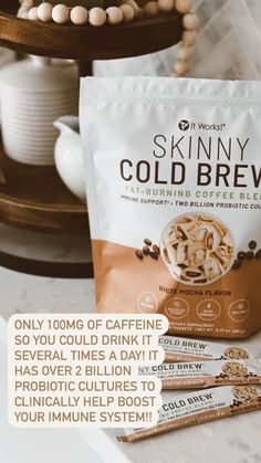 three packets of skinnyy cold brew sitting on top of a counter next to a cup