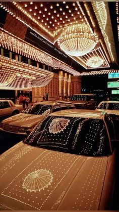 cars parked in a parking lot covered with lights