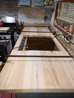 an unfinished kitchen counter is being worked on