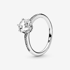 Bring an explosion of sparkle to your outfits with the sterling silver Clear Sparkling Crown Ring.  The claw setting of the large clear cubic zirconia creates the effect of a regal crown on the solitaire ring and is complemented by additional small stones set along the ring band. A ring that’s fit for the special princess or queen in your life, it can be paired with most other selections from the Pandora collection for a truly regal look. - Pandora Clear Sparkling Crown Solitaire Ring - Sterling silver / Cubic Zirconia / Clear - Sz. 8.5 Pandora Collection, Heart Promise Rings, Claw Setting, The Claw, Crown Ring, Jewellery Uk, Small Heart, Ring Band, Lab Created Diamonds