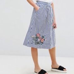 Button Down Striped Midi Skirt, Perfect For Summer, Airy And Pretty. Never Worn With Tags. Bought From Asos. Flower Detail Embroidered On Both The Right And Left Side Of The Front Of The Skirt. Spring Casual Skirt With Embroidered Hem, Casual Embroidered Blue Skirt, Casual Summer Skirt With Embroidered Hem, Casual Spring Skirt With Embroidered Hem, Casual Blue Embroidered Skirt, Embroidered Midi Skirt For Summer, Casual Blue Skirt With Floral Embroidery, Spring Embroidered Midi Skirt, Summer Cotton Skirt With Floral Embroidery