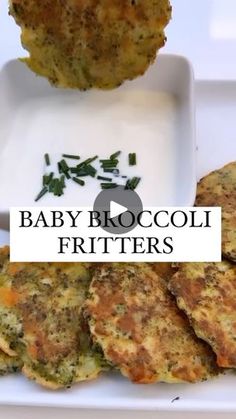 baby broccoli fritters on a white plate with dipping sauce in the middle