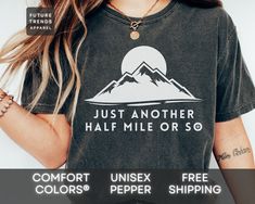 Our Just Another Half Mile or So shirt is a great gift for a hiking and nature lover. The comfortable fit and cool design of this Just Another Half Mile or So shirt means that it feels just as good to wear as it is to look at. If you've been looking for a Just Another Half Mile or So t-shirt for yourself, or your favorite lake and traveling lover, you should get this Just Another Half Mile or So tee today. Comfort Colors® Brand Shirt ▶ Unisex Adult Sizing ▶ See Our Size Chart For Proper Sizing ▶ Casual Black T-shirt For Hiking, Black Pre-shrunk Shirt For Outdoor Activities, Casual Pre-shrunk Shirt For Adventure, Casual Hiking Shirt With Letter Print, Casual Hiking Shirt For Summer, Casual Summer Hiking Shirt, Casual Hiking Shirt With Relaxed Fit, Relaxed Fit Casual Hiking Shirt, Casual Cotton Shirt For Hiking