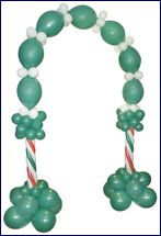 green and white balloon arch with candy canes