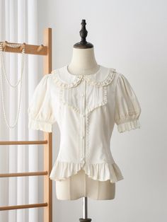 This exquisite piece features short puff sleeves that add a touch of playful femininity, making it an ideal choice for both casual and semi-formal occasions. The blouse is adorned with delicate ruffle trim and intricate pleating detail along the front, crafted from high-quality fabric, this blouse ensures comfort and style all day long.   	 		 			Size 			S 			M 			L 			XL 			2XL 		 		 			Full Length 			56 			57 			58 			59 			60 		 		 			Bust 			92 			96 			100 			104 			108 		 		 			Waist 			80 Puff Sleeves Blouse, Steampunk Fashion Female, Steampunk Fashion Male, Gothic Skirts, Flat Collar, Sleeves Blouse, Steampunk Fashion, Lolita Dress, Lolita Fashion