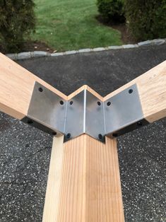 two pieces of wood with metal brackets attached to them