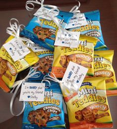 several bags of cookies with tags tied to them