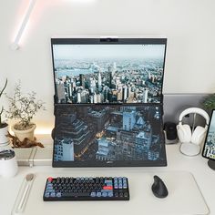 a laptop computer sitting on top of a white desk