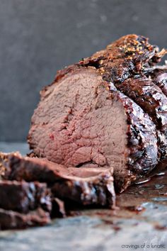 sliced meat sitting on top of a table