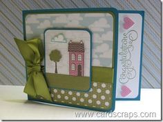 a handmade card with a bow on the front and back of it, featuring a house