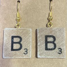 Letter “B” Scrabble Tile Earrings With Hypoallergenic Hooks Handmade - Lightweight, Letter “A” Scrabble Tile Dangle Earrings With Gold Colored .925 Sterling Silver Hooks. (Quarter In Pictures Are For Size Reference.) *Each Pair Of Earrings Is Individually Wrapped And Rubber Backs Are Included. * Scrabble Tile Jewelry, Perler Earrings, Tile Earrings, Tree Of Life Earrings, Dinosaur Earrings, Scrabble Tiles, Handmade Glass Beads, Fish Hook Earrings, Skull Earrings