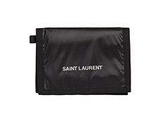 This Saint Laurent trifold wallet in black coated nylon. The front of this wallet features Saint Laurent logo in white, and is trimmed in black nylon. Velcro closure flap opens to five card slots, one zippered coin pocket, and one long bill slot. This slim and sleek trifold is perfect for everyday use, and will hold all of your daily essentials.    Model: 584378  Saint Laurent black trifold wallet  Shiny Nuxx/Rip Stop material (coated nylon)  Flap and Velcro closure    Black nylon interior    Fi Black Trifold Wallet For Travel, Black Trifold Travel Wallet, Black Rectangular Wallet With Logo, Black Rectangular Wallets With Logo, Black Bifold Wallet With Logo, Functional Black Trifold Wallet, Classic Black Trifold Wallet With Zipper, Classic Black Trifold Wallet With Zipper Closure, School Trends