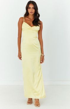 Yellow Maxi Dress  The perfect maxi dress for your next formal or cocktail event. Elegant, stunning and chic - pair with nude heels to complete this gorgeous outfit!   Maxi length  Adjustable spaghetti straps  Satin-like material  Invisible zip up centre back Gathered bust Lined  Light-weight material with no stretch  Side leg split Pale Yellow Maxi Dress, Pale Yellow Dress, Yellow Satin Dress, Silk Yellow Dress, Prom Midi Dress, Jr Prom, Yellow Maxi Dress, Honey Yellow, Spaghetti Strap Prom Dress