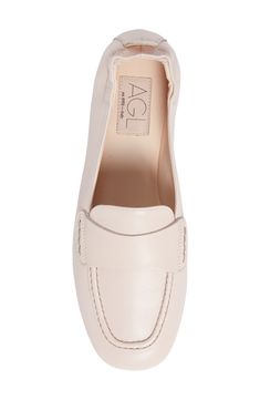 An elasticized topline softens the sophisticated appeal of a supple leather loafer with a moc-stitched toe. Leather upper and lining/leather and rubber sole Made in Italy Women's Shoes