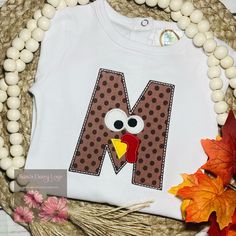 Turkey Alphabet Shirt by Saras Daisy Love Good choices for the boy's Turkey Alpha shirt is white, orange, or gray.  Please leave your preference in the message to seller box.   Turn around time right now is 1-2 weeks, depending on if supplies need to be ordered.  Fabrics may vary but will be same color scheme as shown, as this is a stock photo.    No returns or exchanges But please contact me if you have any problems with your order. *I only use boutique quality blank shirts* Washing Instruction Daisy Love, Thanksgiving Shirts, Boys Top, Boy's Clothing, Color Schemes, Alphabet, Daisy, Boutique, Tops & Tees