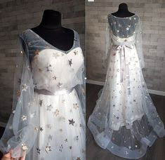 the dress is white and has stars on it