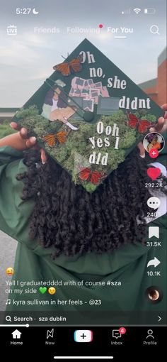 someone is holding their graduation cap over their head