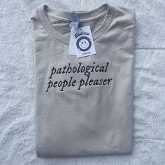 a t - shirt that says,'pattological people pleaser'on it