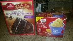 two boxes of cake mix sitting on top of a counter