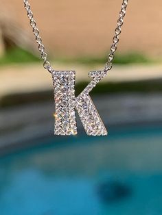 "Diamond Initial Necklace White Gold. Each letter is set with natural clear white sparkling diamonds. As you can see in the photos they have a row of larger Diamonds channel set with smaller diamonds. Beautiful sparkles. We can order any diamond letter. But it takes 4-6 weeks to special order. Please let us know with a message. In stock now ready to ship are Letters B, C, K. The neckchain can be easily adjustable from 15\" to 18\" with extra loops. The letters lay very nicely on the neck. And 18 Luxury Silver Initials Necklace, Luxury Silver Necklaces With Initials, Diamond Initial Necklace In White Gold For Formal Occasions, Luxury Silver Initial Necklace For Anniversary, Formal White Gold Diamond Initial Necklace, Classic Diamond Initial Necklace, Silver Initial Necklace With Diamond Accents For Anniversary, Classic Silver Initial Necklace With Diamond Accents, White Diamond Personalized Jewelry