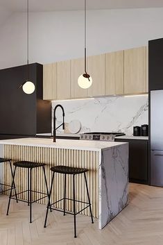 a kitchen with marble counter tops and bar stools next to an island in the middle