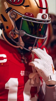 a close up of a football player wearing a helmet