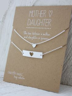 two personalized necklaces on a card that says mother and daughter