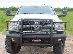 the front end of a truck parked in a field