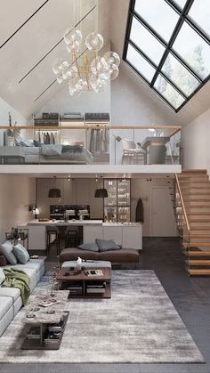 a living room filled with lots of furniture and a staircase leading up to the top floor