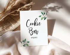 a card that reads cookie bar enjoy on it next to a basket with some leaves