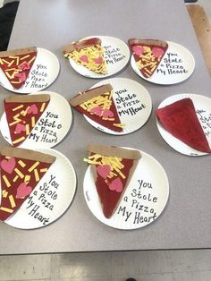 paper plates with slices of pizza on them that say, you stole my heart out