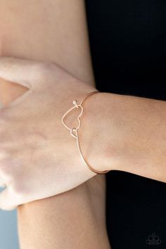 A dainty rose gold heart frame attaches to a dainty rose gold bangle-like cuff, creating a flirty centerpiece around the wrist. Features a toggle closure. Sold as one individual bracelet. Bracelets Trendy, Gold Heart Bracelet, Dainty Rose, Heart Rose, Rose Gold Bangle, Rose Gold Heart, Heart Frame, Toggle Bracelet, Hinged Bracelet