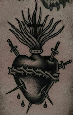 a black and white photo of a heart with swords on it