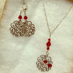 A Gift Set Of Red Crystal And Silver Earrings And Matching Necklace (26” Chain). The Dangling Round Is About 1” Across. Made And Designed With Love By Stella Sherman. See Photos For Details! Silver Pendant Earrings For Valentine's Day, Wire Wrapped Jewelry For Valentine's Day Anniversary, Valentine's Day Gift Necklaces With Matching Earrings, Valentine's Day Wire Wrapped Jewelry For Anniversary, Red Jewelry With Lobster Clasp For Party, Silver Dangle Necklaces For Valentine's Day, Nickel-free Dangle Jewelry For Valentine's Day, Red Party Jewelry With Lobster Clasp, Red Pendant Earrings For Anniversary