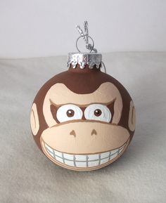 an ornament shaped like a monkey with big eyes