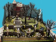 a fake halloween scene is shown in the shape of a house with skeletons and tombstones