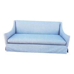 a blue couch sitting on top of a white floor