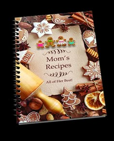 an open spiral notebook with the words mom's recipes written on it