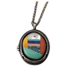 This beautiful, vintage Native American pendant is sterling silver. It features inlay in pink and white mother of pearl, spiny oyster, coral, turquoise and sugilite. The pendant measures 1 1/2 by 2 inches. The 3mm Italian made wheat chain is sterling silver and is 15 inches from end to end. The set weights 33.6 grams. Pendant is hallmarked LH. The chain is hallmarked 925, Italy Condition: Excellent vintage Blue Topaz Pendant Necklace, Southwestern Necklace, Vintage Pendant Necklace, Inlaid Jewelry, Native American Earrings, Turquoise Pendant Necklace, Blue Topaz Pendant, Contemporary Pendant, Stone Inlay