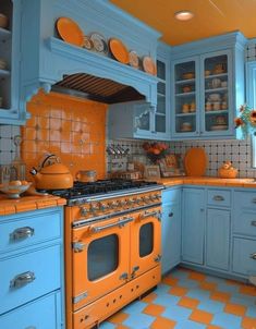 an orange and blue kitchen with checkered flooring on the walls, cabinets and stove