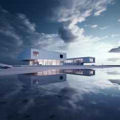 a building that is sitting on top of a body of water with clouds in the background