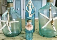 three glass jars with starfish in them and the words how to achieve a stained glass look on plain glass jars