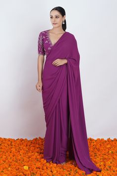 Purple viscose georgette saree. Paired with deep V neck blouse with floral pattern zari and thread embroidery. Component: 2 Pattern: Embroidered Type Of Work: Thread and Zari Work Neckline: Deep V Neck Sleeve Type: Half Sleeves Fabric: Viscose Georgette Color: Purple Other Details: Illusion back Inverted V cut hem on blouse Occasion: Wedding,Destination Wedding - Aza Fashions Formal Pre-draped Saree With Unstitched Blouse In Georgette, Formal Saree Blouse Piece In Georgette, Formal Georgette Blouse Piece For Navratri, Georgette Blouse Piece For Formal Navratri Events, Georgette Blouse Piece For Formal Navratri, Formal Georgette Blouse Piece For Diwali, Formal Georgette Blouse With Dupatta, Formal Georgette Blouse Piece With Cutdana, Formal Georgette Blouse With Resham Embroidery