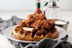 chicken and waffles being poured onto a plate